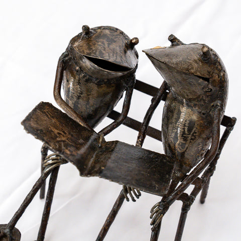 Metal sculpture frogs