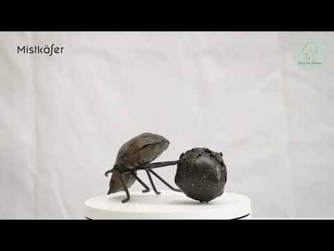 Metal sculpture dung beetle